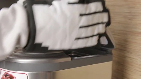 Man is taking away fresh bread from the steamer Stock Footage 69911191