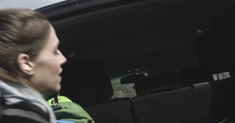 Man taking backpack from off road or SUV four wheel drive vehicle car trunk 動画素材 80866435