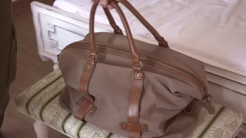 Man taking a bag and leaving from bedroom Stock Footage 132286617