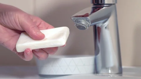 Man taking a bar of soap and washing his hands Stock-Footage 127932294