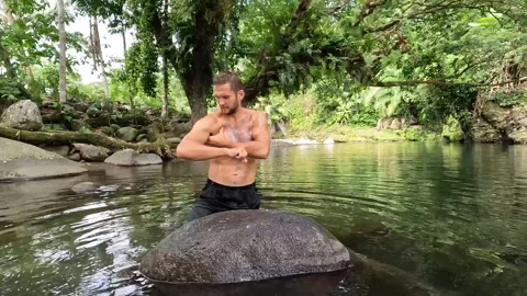 A man taking bath in the river with soap bar Stock Footage 278510273
