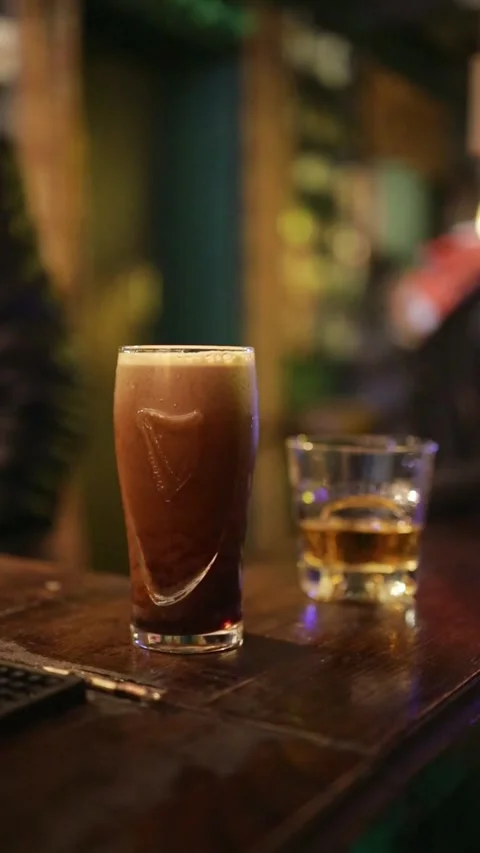 Man Taking Beer and Whisky From Pub Table Stock Footage 323937537