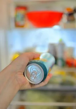 Man taking beer from fridge Free Stock Photos