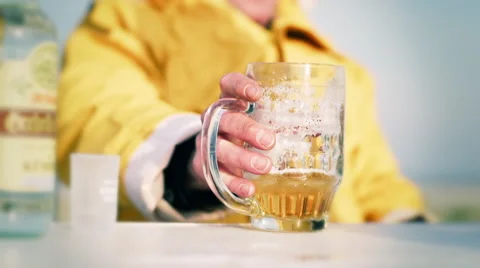 Man taking a beer mug in slow motion. Stock Footage 46273977