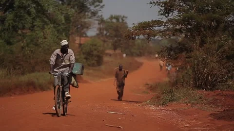 Man taking a bike trip in Uganda Stock Footage 148746933