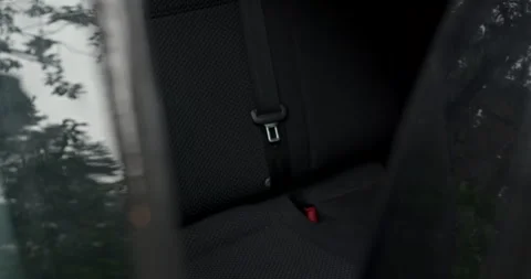 Man taking black travel backpack from car back seat with audio included Stock Footage 340842321