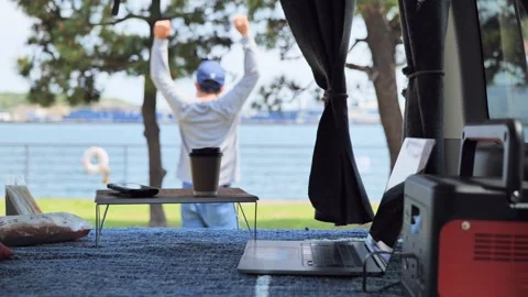 A Man Taking a Break While Working Remotely in His Car Stock Footage 332833128