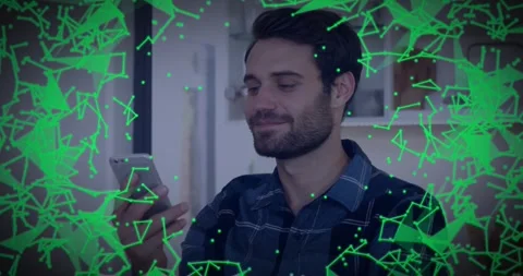 Man taking call in kitchen, processing call and smiling while green network Stock Footage 329812744