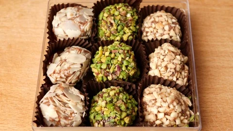 Man taking candy from candy box. Stock Footage 70807967