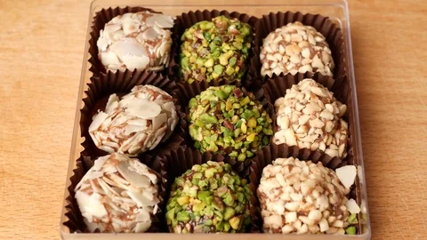 Man taking candy from candy box. Stock Footage 70808169