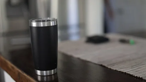 Man taking car key, wallet and tumbler with coffee out of table Stock Footage 127796111
