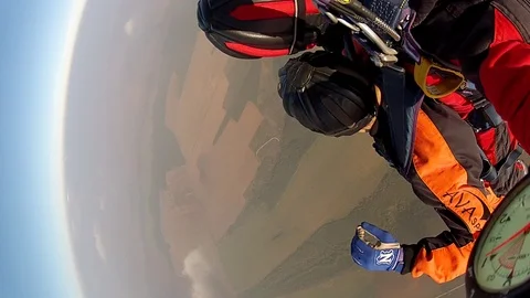 Man taking control over parachute from instructor Stock Footage 92655279