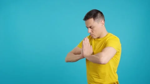 Man taking a deep breath while meditating Stock Footage 246654070