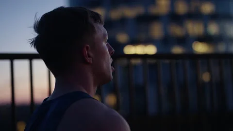 Man Taking Deep Breaths At The Rooftop Video stock 230494046
