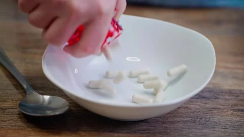 Man Taking Excessive Pills With Spoon 動画素材 340504019