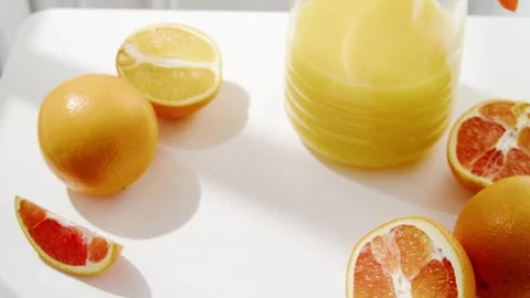 Man Taking Fresh Squeezed Juice Glass Slow Motion Closeup Video stock 330092117