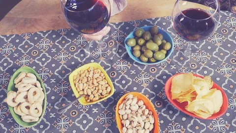 Man taking glass of wine from table with appetizer and snacks slow motion ret Stock Footage 89846531