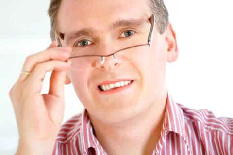 Man taking off glasses Stock Photos