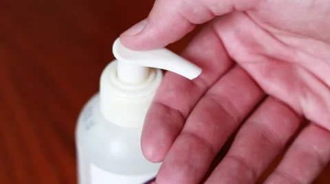 Man taking a hand cream Vídeo Stock 64623629