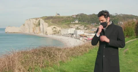 Man taking of his mask in vacation Stock Footage 156528221
