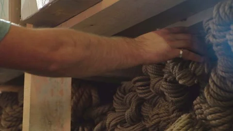 A Man Taking hold of Rope Stock Footage 137771170