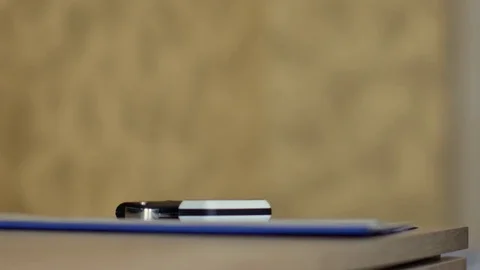 Man is taking keys and documents from the table. 4K video Stock Footage