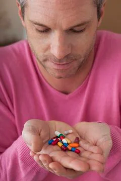 Man taking medication Stock Photos