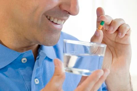 Man taking medication 스톡 사진