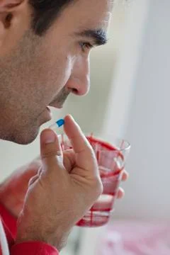 Man taking medication Stock Photos