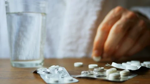Man taking medicine Stock Footage 127249981