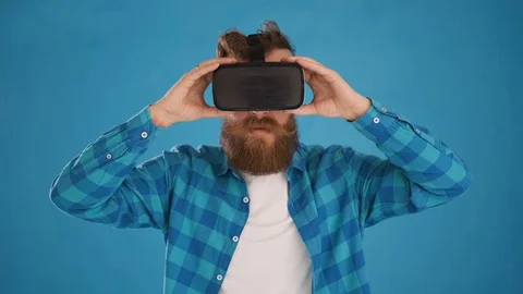 Man taking off modern 3D VR augmented reality glasses, shocked, interested Stock Footage 127626184