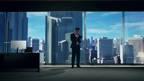 Man Taking Note On A Tablet with Skyscrapers Stock Footage 269705978