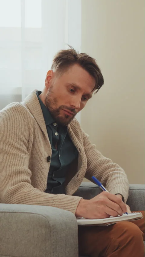 Man Taking Notes During Counseling Session Stock Footage 281659005