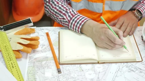 A man is taking notes in a notebook Stock Footage 73802784