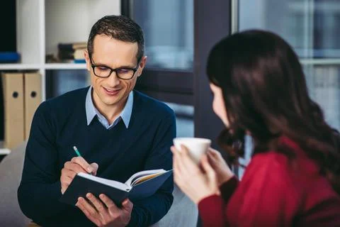 Man taking notes in notebook Stock Photos