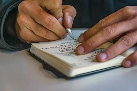 Man taking notes at notebook 스톡 사진