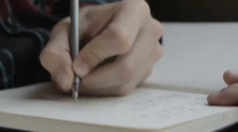 Man taking notes on a pad on a journey Stockbeeldmateriaal 64902422