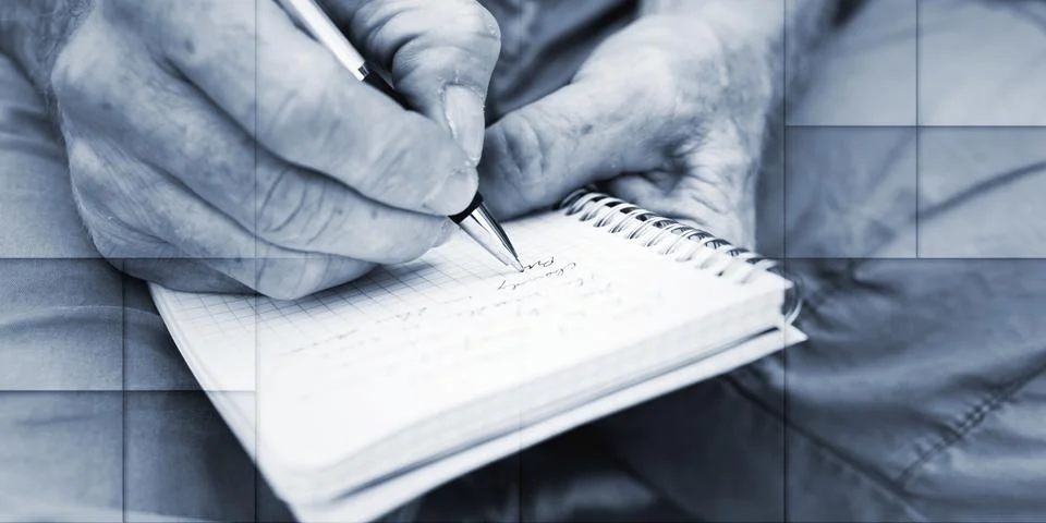 Man taking notes on a pocket book, geometric pattern Stock Photos