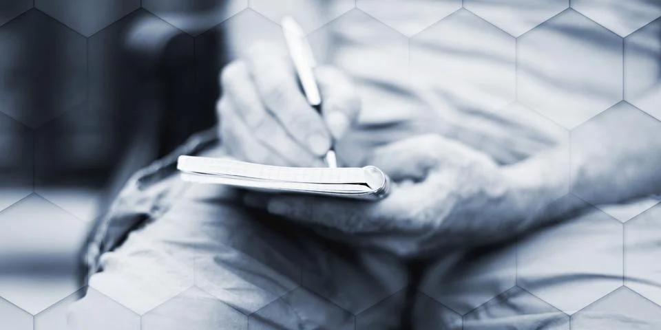 Man taking notes on a pocket book, geometric pattern Stock Photos