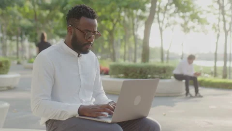 Man Taking Notes while Speaking on the Phone in Cafe Stock Footage 234973424
