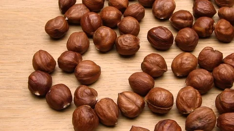 Man taking one hazelnut. Dolly shot. Stock Footage 71042168
