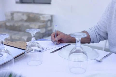 Man is taking order in restaurant Stock Photos