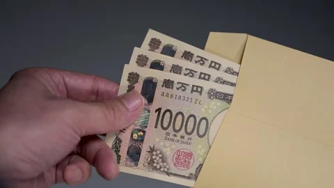 Man taking out bribe yen bills from an envelope Stock Footage 336765895