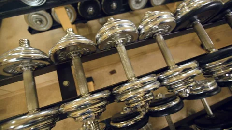 Man taking out dumbbell Stock Footage 60426971