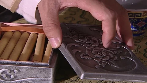 The man is taking out a foreign cigarette from the cigarette box Video stock 276516526