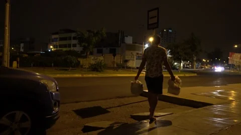 Man taking out the garbage from the house at night Stock Footage 149218704