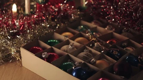 Man taking out red old vintage christmas sphere toy out of the box Stock Footage 70070517