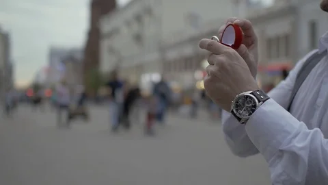A  man is taking out a wedding ring out of his pocket and making a proposal. Stock Footage 114497938