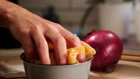 Man taking pasta for cooking Stock Footage 156787924
