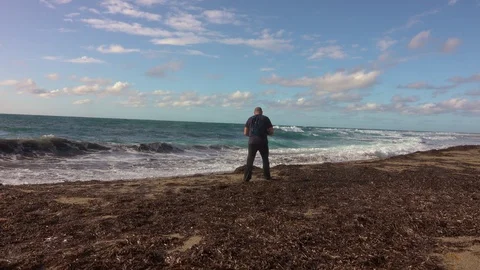 Man taking a photos with dslr camera outdoors, on the beach Stock Footage 120728739